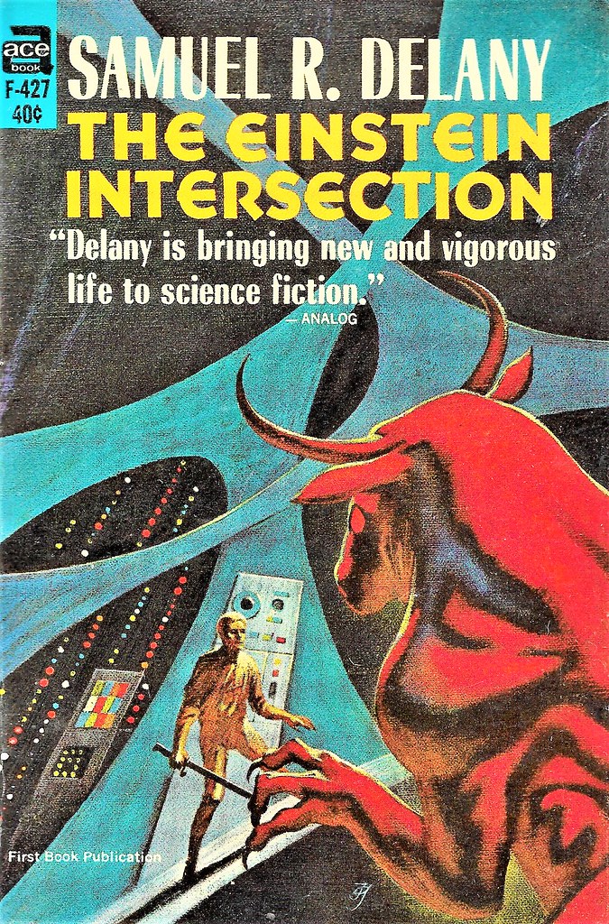 1960s pulp cover of Samuel R. Delany's novel 'The Einstein Intersection,' with a painting of a dramatically lit bull monster facing down a person near a machine with a sword(?) in his hand.