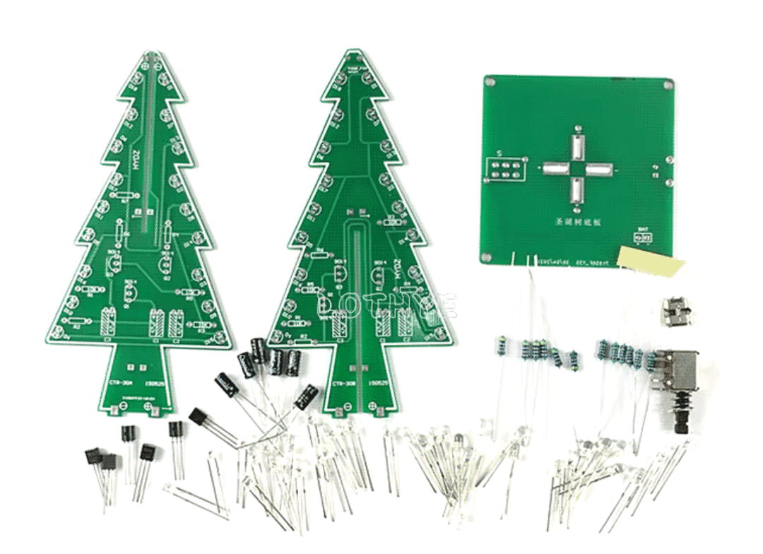 Photo of an electronics kit with two circuit boards shaped like Christmas trees, a square base, and a collection of transistors, capacitors, LEDs, resistors, etc.