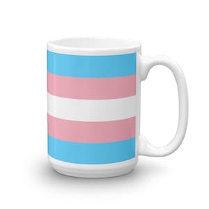 Coffee mug with the trans flag printed on it (pastel blue, pastel pink, and white stripes)