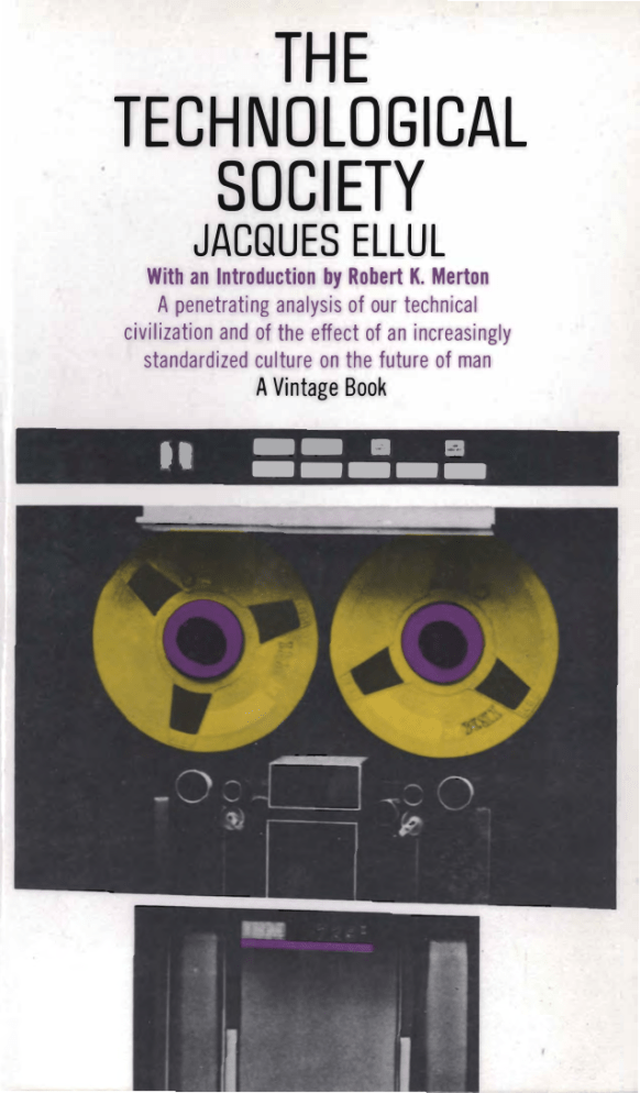 Cover of the mass market edition of 'The Technological Society' by Jacques Ellul, with a photo of an IBM reel-to-reel tape machine with the reels colored purple and yellow