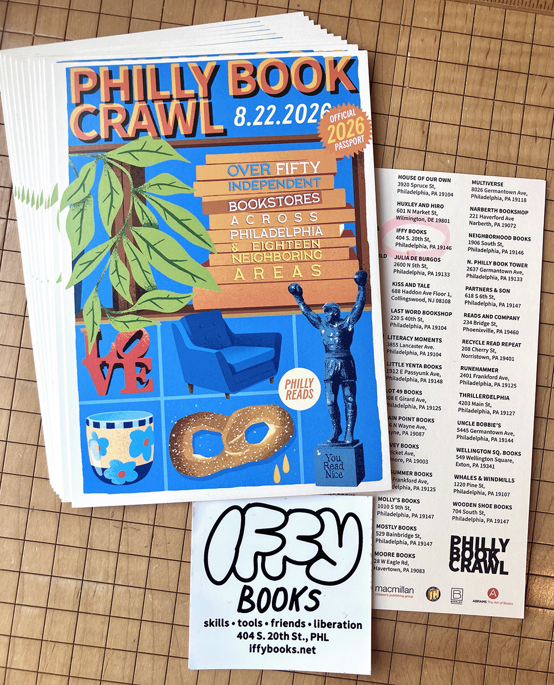 Flyer for the Philly Book Crawl (8.22.2026) with the following text beside a soft pretzel, the rocky statue, the Love statue, a cup, and a plant: "Over fifty independent bookstores across Philadelphia & eighteen neighboring areas," beside a square sticker for Iffy Books